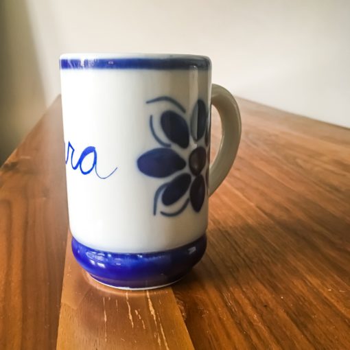 Ceramic mug from brazil that says 'cura'