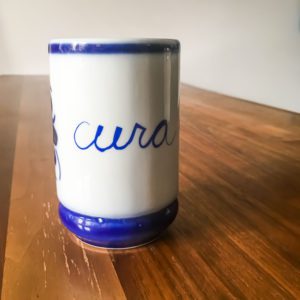 Ceramic mug from brazil that says 'cura'