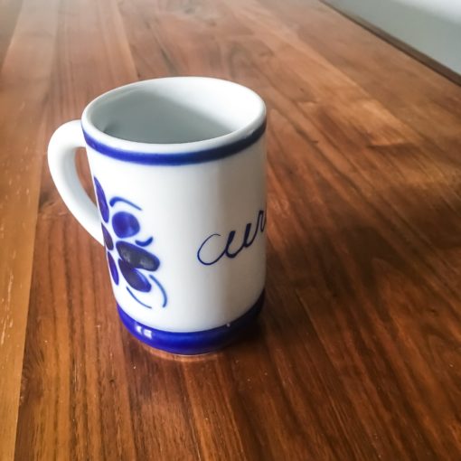 Ceramic mug from brazil that says 'cura'