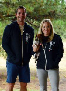 Man and Woman wearing CURA's 'do good' hoodie.